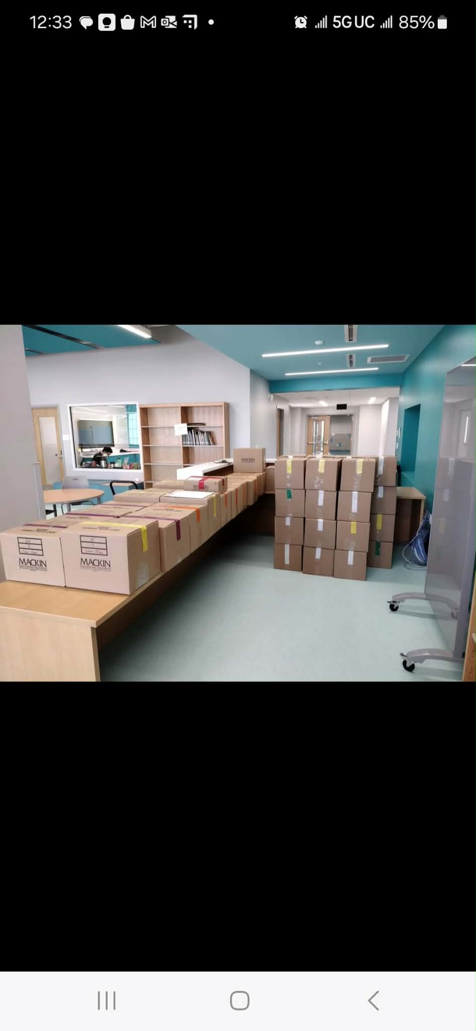 Commercial office move with organized boxes in a professional setting